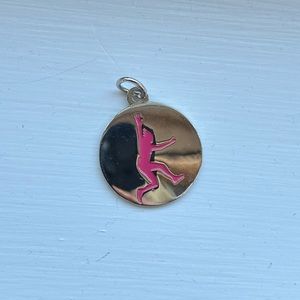 Dirty Girl silver tone pendant.